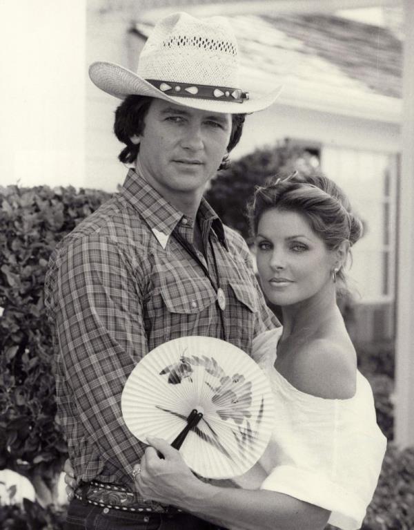 Patrick Duffy and Priscilla Presley posing together during their time on the hit show 'Dallas' between 1983-1988
