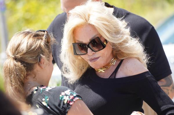 'Catwoman' Jocelyn Wildenstein is seen at The Beach Polo World Cup in Miami, Florida with fianc? Loyd Klein.