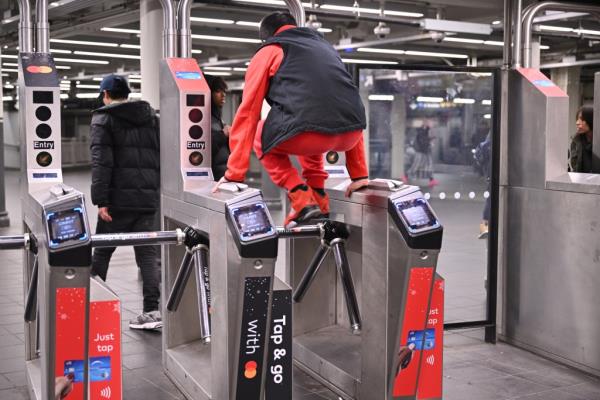 man jumping turnstile