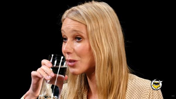 Gwyneth Paltrow sipping watter. 