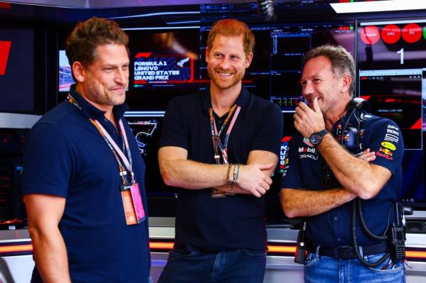 Christian Horner talks with Prince Harry, Duke of Sussex in the garage prior to the F1 Grand Prix.