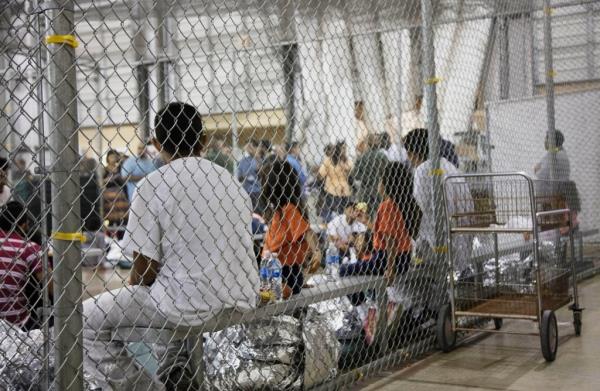 People who've been taken into custody related to cases of illegal entry into the United States, sit in one of the cages at a facility in McAllen, Texas.
