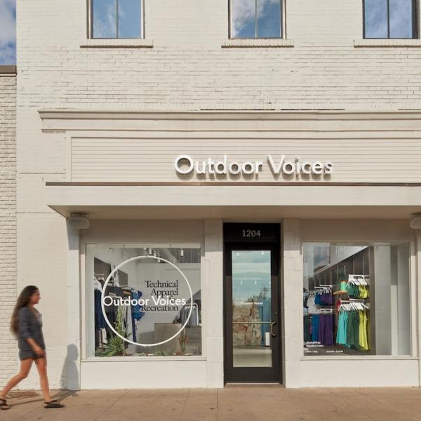 A woman walking past the Outdoor Voices store at 1204 S Co<em></em>ngress Ave, Austin, TX