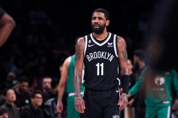 Nets guard Kyrie Irving (11) reacts in the second half against the Boston Celtics