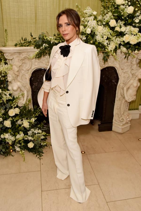Victoria Beckham, 50,  in a necktie at the British Vogue and Tiffany & Co. party. 
