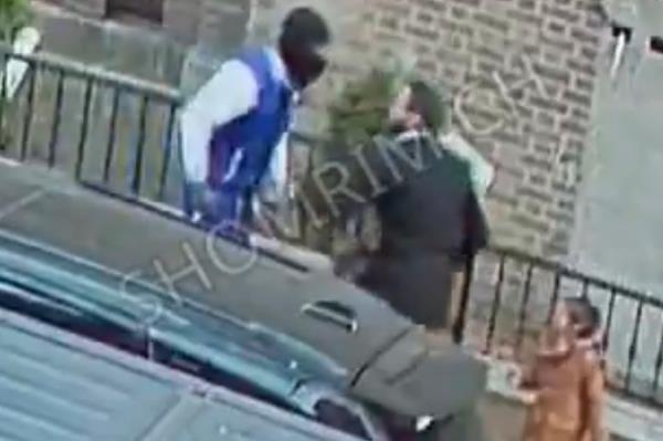 The father and the assailant stared each other down before the suspect fled the area.