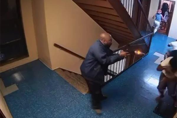 Screenshot from a surveillance video shows a suspect shooting a Brooklyn father and his stepson in East Flatbush Sunday 