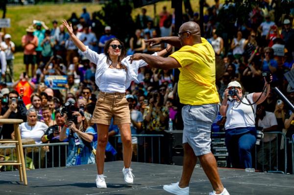 AOC greets Bowman during the rally held in St. Mary's Park.