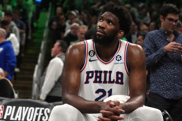 Philadelphia 76ers center Joel Embiid (21) watches from the bench as the 76ers fall behind the Boston Celtics during the second half of Game 7 in the NBA basketball Eastern Co<em></em>nference semifinal playoff series, Sunday, May 14, 2023, in Boston.