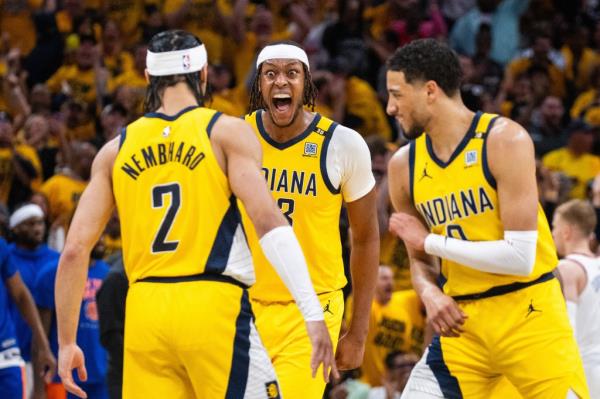 Pacers center Myles Turner (33) reacts to guard Andrew Nembhard (2) celebrates his game clinching three-point basket