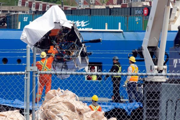 Mangled wreckage from the doomed Titan sub was finally hauled ashore Wednesday, 10 days after it imploded, killing all five passengers on a deep-sea tour of the Titanic.