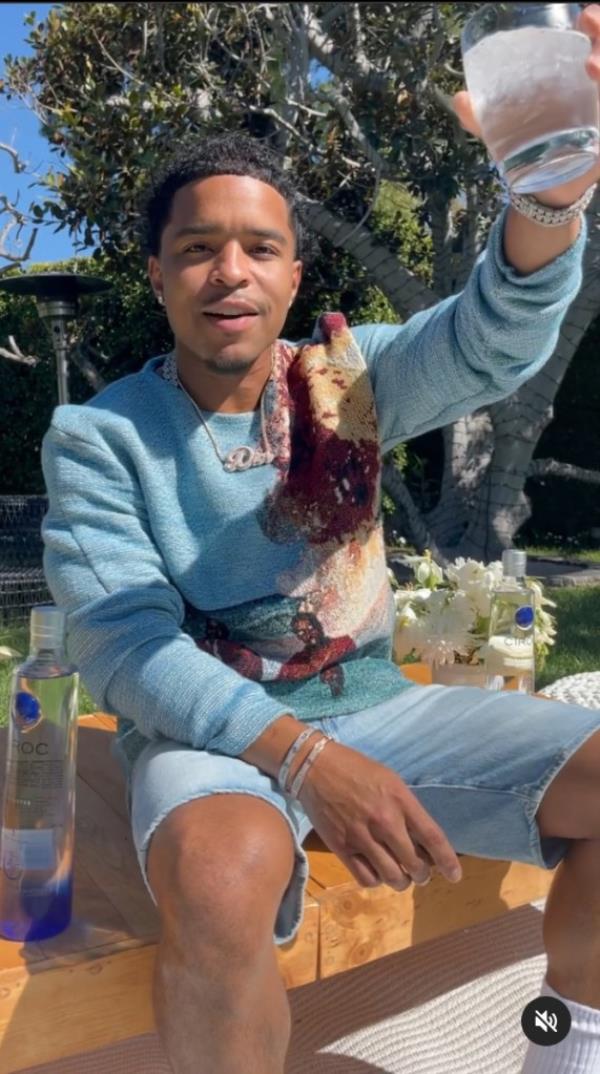 Justin Combs raising a glass of vodka 