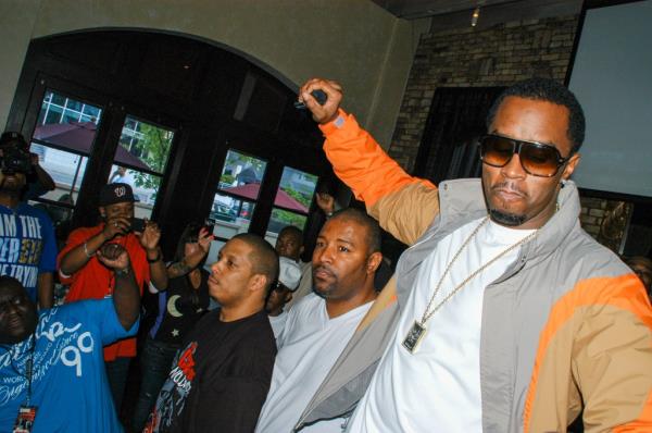 Diddy holding a mic and partying 