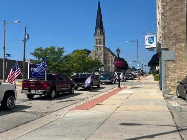 Trump parade participants roll through downtown Watertown, Wis., on Saturday morning.