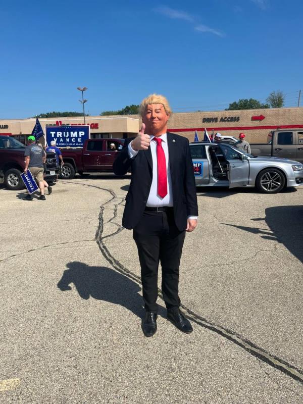 A Trump parade organizer dressed as the former president on Saturday in Watertown, Wis.