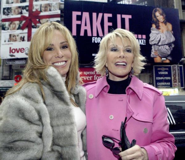 112803, Shopping:  Melissa Rivers and her mother Joan Rivers point out the new billboard at 7th Avenue and 48 Street in Manhattan's Theater District.  