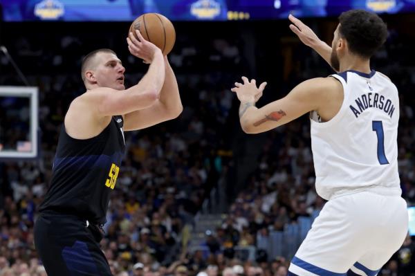 Nikola Jokic #15 of the Denver Nuggets shoots the ball against Kyle Anderson #1 of the Minnesota Timberwolves during the second quarter in Game Five of the Western Co<em></em>nference Second Round Playoffs at Ball Arena on May 14, 2024 in Denver, Colorado.