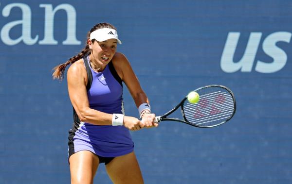 Jessica Pegula (USA) [6] returns a volley against Diana Shnaider [18] during their match on Arthur Ashe Stadium at the 2024 US Open Championship.
