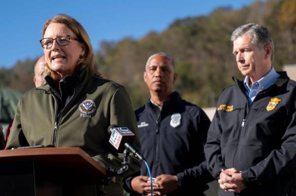 A photo of FEMA Administrator Deanne Criswell speaking to members of the press.