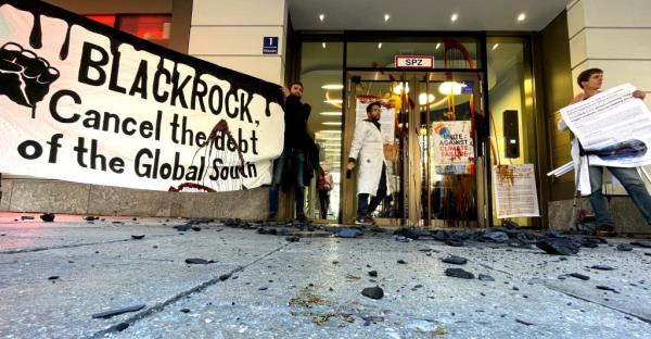 Activists of the climate change group Scientist Rebellion protest outside the Blackrock building in Munich, Germany, October 25, 2022.
