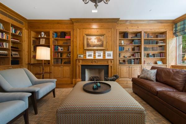 The wood-paneled library.