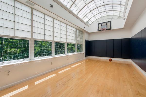Glass encased basketball court in a luxury home at 160 East 83rd Street