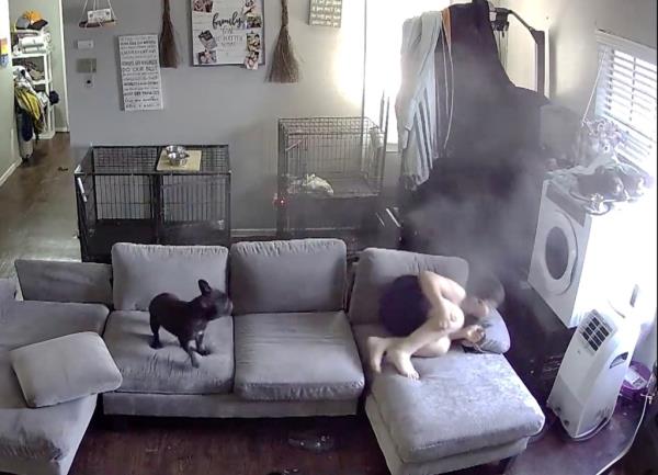 The same boy ducking for cover on the couch.