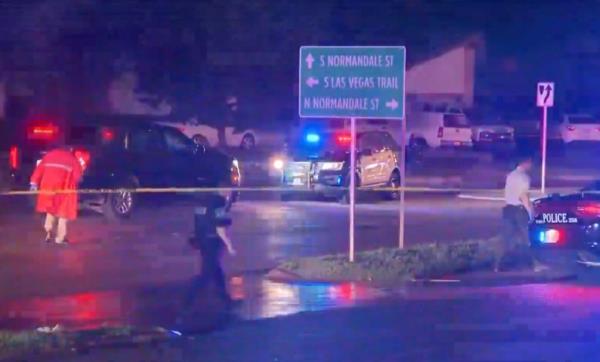 Heavy police presence on a darkened street in Fort Worth Texas.