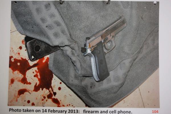 epa04396684 A handout image made available on 12 September 2014 by the South Africa Police Services shows on 14 February 2013 a mobile telephone, firearm and blood splatter in the house of South African Paralympic athlete Oscar Pistorius wher<em></em>e his girlfriend Reeva Steenkamp, shot. The judge in the trial of Oscar Pistorius, on 12 September 2014, ruled he is guilty of the culpable homicide of his girlfriend, Reeva Steenkamp. EPA/SOUTH AFRICA POLICE SERVICES / HANDOUT HANDOUT EDITORIAL USE ONLY/NO SALES
