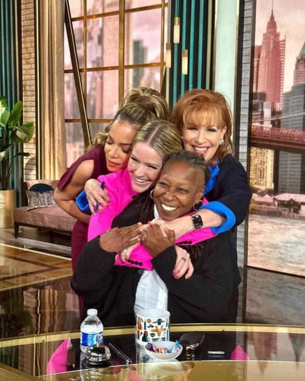 Whoopi Goldberg, Joy Behar, Sara Haines, and Sunny Hostin hugging each other during a commercial break on The View