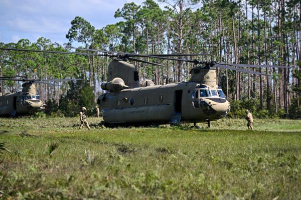 Boeing CH-47 Chinook helicopters land after Hurricane Helene made landfall in Keaton Beach, Florida, on September 27, 2024. 