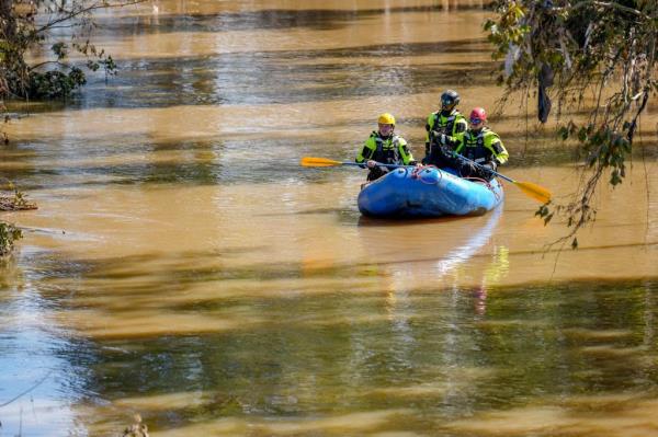 Asheville first respo<em></em>nders paddle up the Swannanoa River during the aftermath of flooding caused by the remnants of Hurricane Helene.