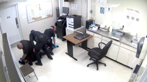 Footage from the attack in Warren that led to a cop being charged with assault.
