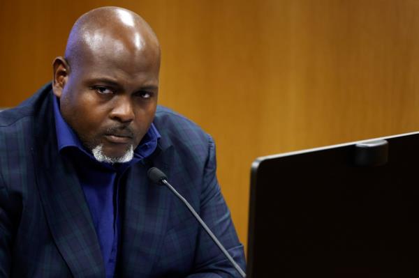 Terrence Bradley testifies at a hearing on Georgia election interference, sitting at a microphone.