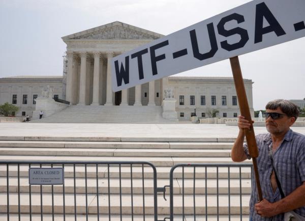 A demo<em></em>nstrator outside the Supreme Court.