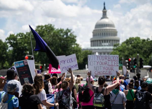 Abortion rights demo<em></em>nstrators mark the anniversary of the overturn of Roe v. Wade.