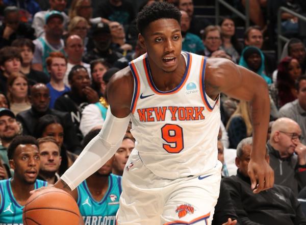 RJ Barrett, driving to the basket, scored 15 points in the Knicks' 122-108 win over the Hornets, his first game back after missing three games due to migraines.