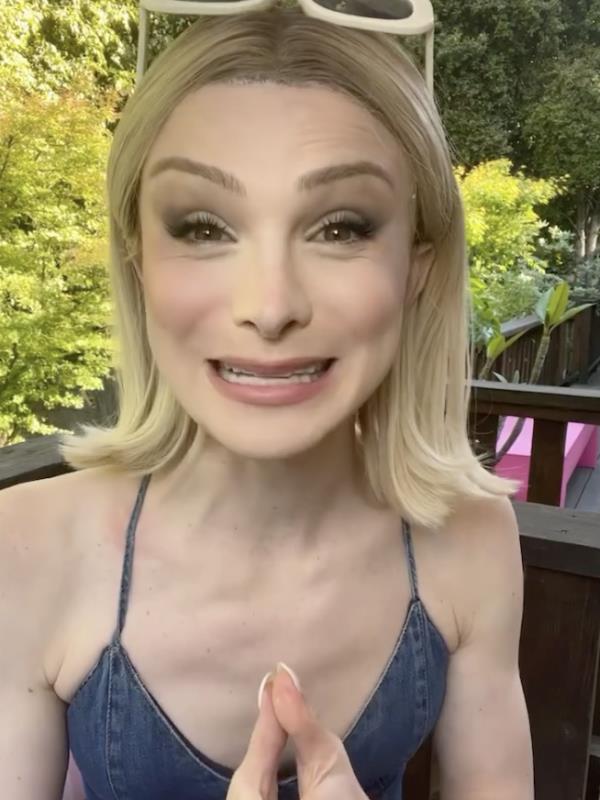 A transgender woman smiles