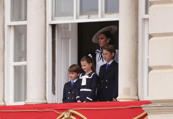 Royal fans were heartened to see the three children standing alo<em></em>ngside their mom. 