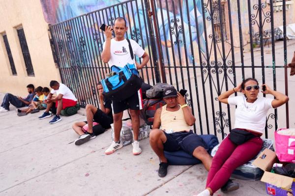 Migrants gathered outside of the shelter at the Sacred Heart Church in El Paso, Texas on August 8, 2023.