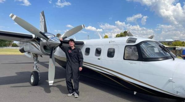Jennings is pictured next to a plane.
