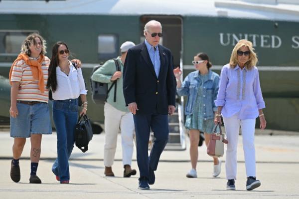 President Joe Biden and First Lady Jill Biden with daughter Ashley (2R), granddaughters Maisy (L) and Naomi (2L) and Naomi's husband Peter Neal (3L) make their way to board Air Force One before departing Los Angeles Internatio<em></em>nal Airport in Los Angeles, California on June 16, 2024.