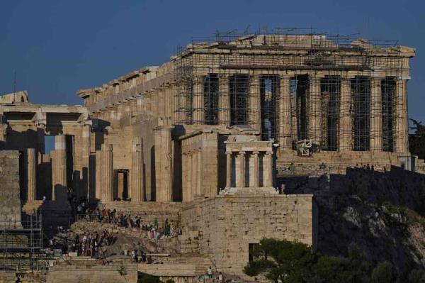 The tourist was caught trying to take a piece of the Propylaea -- the gateway to the Acropolis -- by another tourist