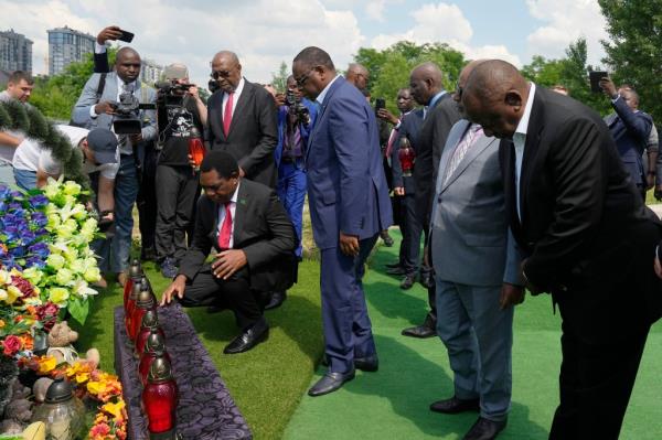 From right, South African President Cyril Ramaphosa, President of the Unio<em></em>n of Comoros Azali Assoumani, Senegal's President Macky Sall, and Zambia's President Hakainde Hichilema, bottom, attend a commemoration ceremony at a site of a mass grave in Bucha, on the outskirts of Kyiv, Ukraine, Friday, June 16, 2023.