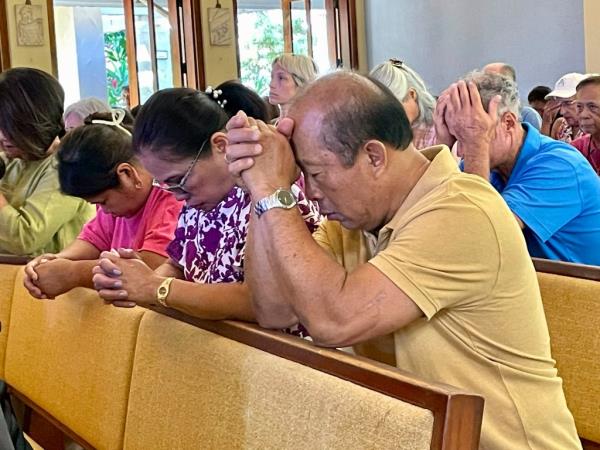 Parishio<em></em>ners attend Mass at Sacred Hearts Mission Church in Kapalua, Hawaii, Aug. 13, 2023.
