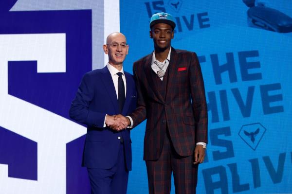 Brandon Miller poses with NBA commissio<em></em>ner Adam Silver after being drafted second overall pick by the Charlotte Hornets.