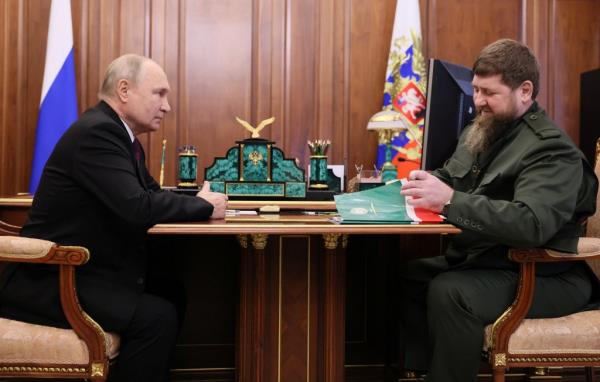 Russian President Vladimir Putin sits down to chat with Chechen leader Ramzan Kadyrov during a meeting in Moscow, Russia, on Sep. 28, 2023.
