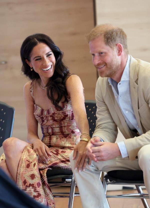 Prince Harry and Meghan, Duchess of Sussex, sitting in chairs during their visit to the Centro Nacio<em></em>nal de las Artes Delia Zapata in Bogota, Colombia on August 15, 2024