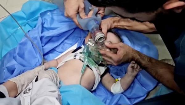 Medical workers use a manual resuscitator as they try to rescue Palestinian baby Mosab Sobieh, who is less than a year old and was injured in an Israeli strike on their home, at the Indo<em></em>nesian Hospital that ran out of fuel and electricity, in the northern Gaza Strip, in this still image taken from a video obtained by Reuters, November 12, 2023. 