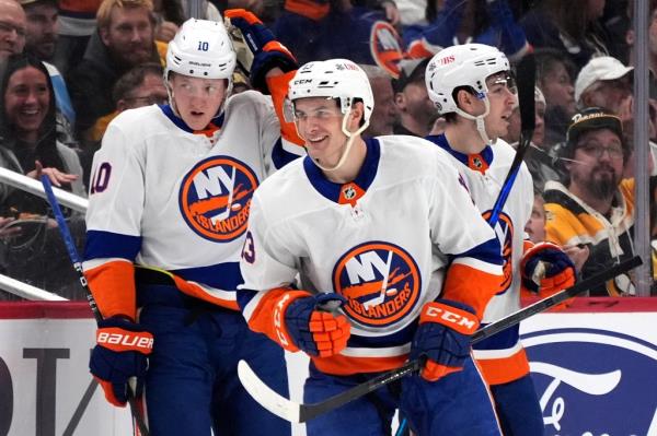 Mathew Barzal, center, head back to the bench after scoring against the Pittsburgh Penguins during the second period on Tuesday.